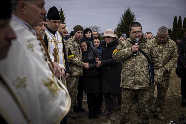 Anzhelika Verveyko (24) is comforted by a friend during the funeral ceremony for her husband, Senior Sergent Yevhen Verveyko of the Ukranian National Army, who was killed fighting against Russian forc...