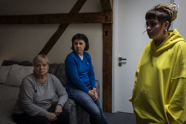 Yulia, Nastia and Olena in their hotel room in Lviv the day after they had escaped the besieged city of Kharkiv.