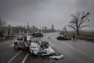 Destroyed civilian cars litter a main road leading out of the recently liberated town of Bucha.