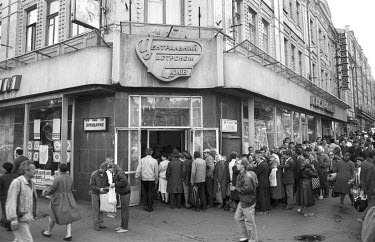 Queues for food at a state run shop. In the run up to independence the Soviet collective farming system collapsed which, when combined with runaway inflation, caused severe food shortages for the majo...