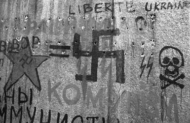 Graffitti equating the Soviet Union with a Nazi regime scrawled on the base of Lenin's statue, which towered over the main square of Kiev, during the run-up to Ukraine's independence in 1991. The loca...