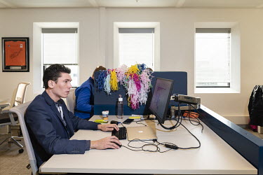 An employee at work in his office at the headquarters of Rabobank.