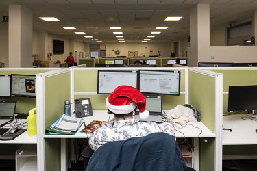 An employee wearing a Christmas hat at the headquarters of Argenta bank.