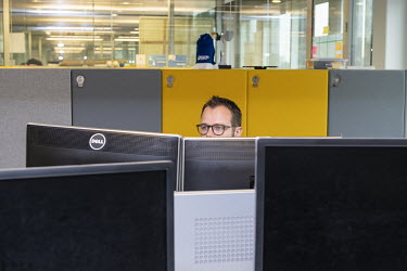An employee at work in his office at the Aegon headquarters.