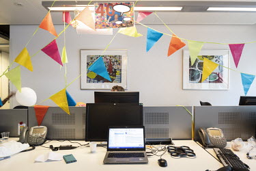 Nunting decorates an office in celebration of an employee's birthday in the Aegon headquarters building.