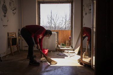 Vyacheslav Ostapenko (55), who works for a Ukrainian TV network, Channel 5, cleans his destroyed apartment hours after it had been damaged when part of a Russian missile, intercepted by Ukrainian air...