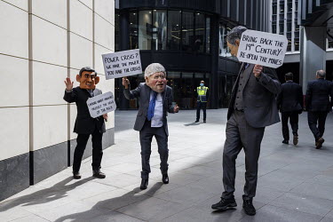 Extinction Rebellion activists dressed as politicians during a protest at the Lloyds of London insurance building in the City of London.