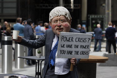 Extinction Rebellion activists dressed as politicians during a protest at the Lloyds of London insurance building in the City of London.