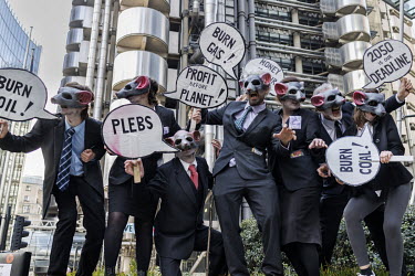 Extinction Rebellion activists from the 'Corp Rats' group during a protest at the Lloyds of London insurance building in the City of London.