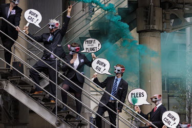 Extinction Rebellion activists from the 'Corp Rats' group during a protest at the Lloyds of London insurance building in the City of London.