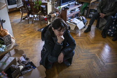 Iryna Popova squats in her apartment, in shock after a Russian missile, intercepted by Ukrainian air defences, hit her building in northern Kyiv badly damaging her home.
