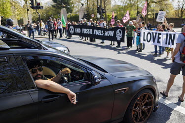 Extinction Rebellion activists block a road near Hyde Park in a protest against fossil fuels.