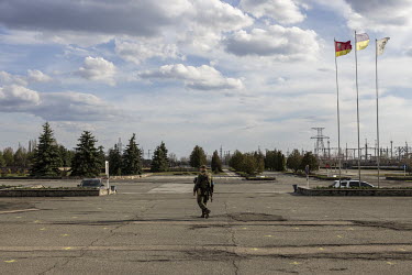 An Ukrainian soldier walks in front of the main station at the Chernobyl nuclear power plant. Ukraine regained control of the area after Russian forces retreated back over the border into Belarus on 3...