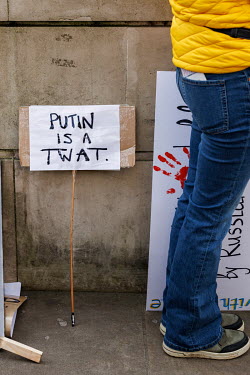 A placard reads: 'Putin is a Twat' during a solidarity protest in Whitehall against the Russian invasion of Ukraine. The protest brought together Ukrainians, Russians, Uyghurs and others.