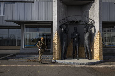 An Ukrainian soldier walks in front of the main station at the Chernobyl nuclear power plant. Ukraine regained control of the area after Russian forces retreated back over the border into Belarus on 3...