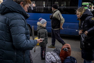 Svetlana (right) and her son Dyma arrive at Kyiv train station, having escaped Chernihiv. "We were a group of seven with one child and a grandmother who is disabled", said Svetlana (40). "We had to ma...