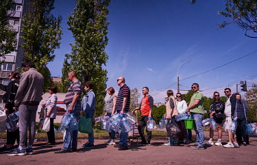 Citizens of Mykolaiv collect drinking water from a tanker. The city has had no drinking water since 12 April 2022 due to heavy Russian bombardment which has destroyed supply infrastructure.