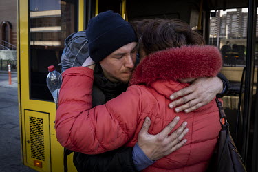 People arrive at Kyiv central train station having being evacuated, through Russian controlled territory, from the besieged town of Bucha in the suburbs of northwestern Kyiv.