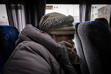 A woman cries as she reaches the relative safety of Kyiv city, having managed to escape the besieged city of Chernihiv.