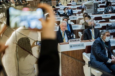 Simon Manley, the UKs Permanent Representative to the UN in Geneva, speaking, while being filmed by another British diplomat, during the emergency debate on Ukraine at the UN Human Rights Council.
