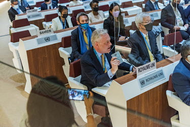 Simon Manley, the UKs Permanent Representative to the UN in Geneva, speaking during an Emergency debate on Ukraine at the UN Human Rights Council. He is holding up a copy of the UN charter for a photo...