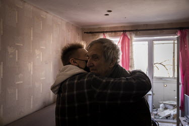 Vladimir Bogdanov (80), narrowly escaped injury, sitting on his couch when shrapnel tore into his front room and gouged holes in the ceiling and walls in a Russian multiple rocket attack in the Nyvky...