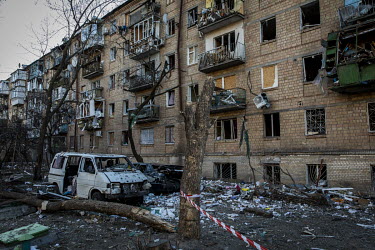 A bomb-damaged residential apartment block in north western Kyiv. The bombardment by Russian forces caused considerable damage to several apartment blocks and a nearby school.