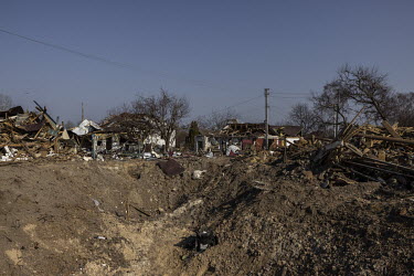 A massive crater caused by a Russian Iskander missile, that landed in a village and destroyed multiple houses in the first week of the war in Ukraine.
