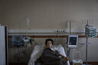 Dima Neron (19), from the Chernihiv region, recovering in hospital. Dima was charging his phone from a generator, when his family's farm in Kulikovka village was bombed by Russian forces on 21 March 2...