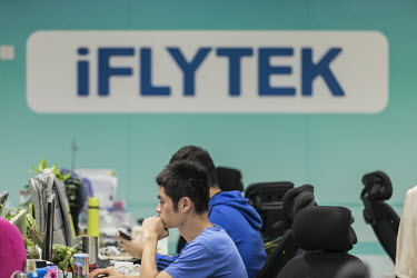 Employees work inside Iflytek Co.'s regional headquarters in Guangzhou, China, on Tuesday, Oct. 31, 2017. Iflytek, which specializes in voice recognition, has been blacklisted by the U.S. government o...