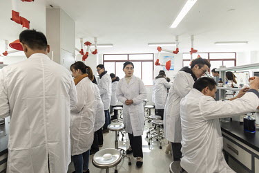 Students attend a chemistry class at Kweichow Moutai Co.'s Moutai University in Renhuai.