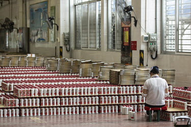 Employees work on the bottling line at the Kweichow Moutai Co. liquor factory in the town of Maotai in Renhuai. First favoured and promoted by former Chinese premier Zhou Enlai, Moutai Baijiu's fiery...