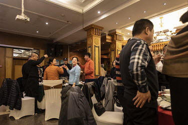 Visitors make a toast while dining in a canteen at the Kweichow Moutai Co. liquor factory in the town of Maotai in Renhuai. First favoured and promoted by former Chinese premier Zhou Enlai, Moutai Bai...