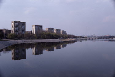 Soviet apartment blocks line a man-made lake in the Donbas region.