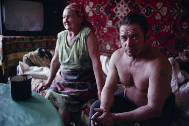 Vladimir, a coal miner, and his wife in the front room of their home in a sprawing neighbourhood where miners live. Ukrainian coal miners went on strike for political change at the Kremlin, contributi...