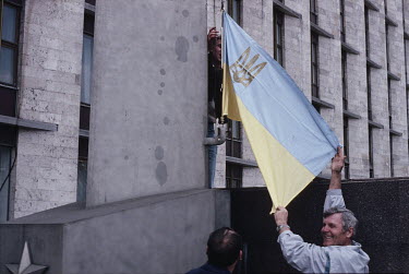 Flags of an independent Ukraine are flown by striking coal miners at a rally in front of the communist party headquarters. Despite Mikhail Gorbachev's Perestroika and Glasnost reforms, Ukrainian coal...