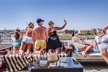 A group of tourists take a selfie on the deck of a yacht taking tourists on a pleasure cruise from Hurgarda, a Red Sea resort popular with tourists from Russia and Eastern Europe.