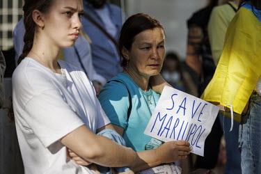 A woman holds a sign which reads 'Save Mariupol' during a protest in Whitehall against the Russian invasion of Ukraine.