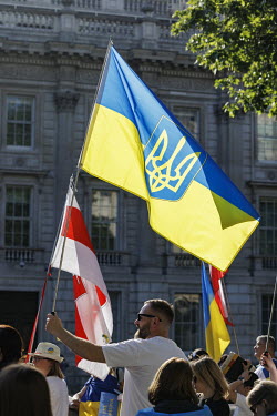 A man holds a Ukrainian flag during a protest in Whitehall against the Russian invasion of Ukraine.