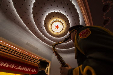 A member of the Chinese People's Liberation Army (PLA) band inside the Great Hall of the People ahead of the opening of the first session of the 13th Chinese People's Political Consultative Conference...