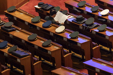 Military delegate's hats on desks during the 13th National People's Congress (NPC) at the Great Hall of the People.