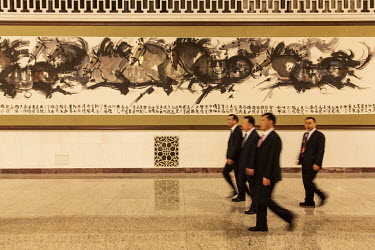 Delegates walk through the 13th National People's Congress (NPC) at the Great Hall of the People.