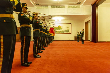 A military band practices in a hall before a voting session at the first session of the 13th National People's Congress (NPC) at the Great Hall of the People.