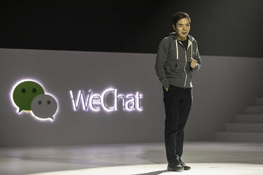 Allen Zhang, senior executive vice president at Tencent Holdings Ltd. and founder of the company's WeChat app, speaks during his keynote speech at the WeChat Open Class Pro conference.