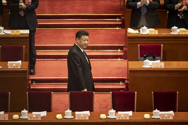 Chinese President Xi Jinping walks into the Great Hall of the People ahead of the opening of the first session of the 13th Chinese People's Political Consultative Conference (CPPCC).
