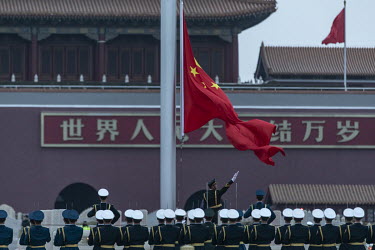 A team of honour guards participate in the flag raising ceremony on Tiananmen Square.