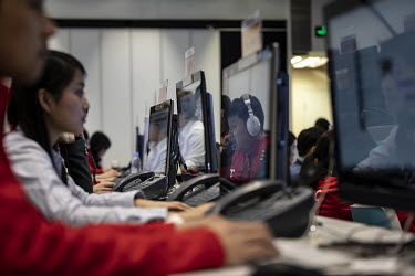 Staff at work in an iTutorGroup office. After seeing raid growth and investment, China's online tutoring sector has all but vanished after a series of government crackdowns.