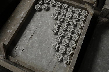 Clay flowers drying inside a workshop at the Jingdezhen Porcelain Factory.