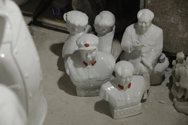 Busts of former Chinese leader Mao Zedong sit on the floor inside a workshop at the Jingdezhen Porcelain Factory.