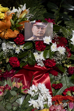 A bouquet of flowers with a picture of Stalin among the blooms at the Tiergarten on 8 May 2022, the 77th anniversary of the 1945 victory against Nazi Germany and the end of World War Two. Due to Russi...